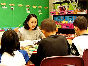 
Xay Thaw says her students are fluent in Hmong but need a lot of work on English.

 (MPR Photo/Tim Pugmire)