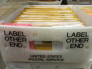 
A tray full of absentee ballots.  Most list a campground as for the return address. (MPR Photo/Mark Steil)