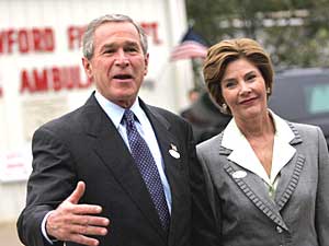 
President George W. Bush and first lady Laura Bush spoke to the press after voting at the Crawford Volunteer Fire Department Friday morning. Bush return to the White House this afternoon to wait for the election results.  (Photo by TIM SLOAN/AFP/Getty Images)