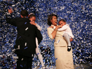 
 Candidate for the U.S. Senate Barack Obama (D-IL) (L) holding his daughter Malia with wife Michelle and youngest daughter Sasha (R) celebrate his victory with supporters over Repulican rival Alan Keyes November 2, 2004 in Chicago, Illinois.  (Photo by Scott Olson/Getty Images)