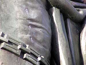 
Hermann was an easy target through the years.  Several dozen bullet holes like these were repaired during the statue's restoration.    (MPR photo/Mark Steil)