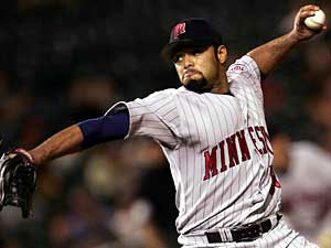 Minnesota Twins pitcher Johan Santana watches a sixth inning pitch on his  way to his sixth win as the Twins beat the Milwaukee Brewers 6-3 Friday,  June 25, 2004 in Minneapolis. (AP