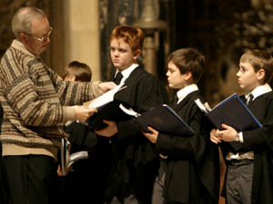 
King's College Choir Director of Music Stephen Cleobury  goes over the parts with the attentive choristers.  (© Eric Melzer)