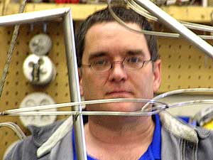 
Jeff Zachmann started his art career as a production potter. He insists each kinetic sculpture be unique.  (MPR photo/Dan Gunderson)