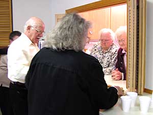 
Church members gather for coffee and homemade sandwiches after the service.  Most of those who attend the Bethel and Carmel churches are retired.  But they're slowly attracting younger members.  (MPR Photo/Stephanie Hemphill)