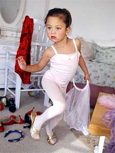 
Four-year-old Allegra plays dress-up in her home in Malibu, California. (Photo copyright 2004 by Lauren Greenfield)