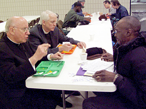 
The bishops have dinner with Samuel, a homeless man who comes to Loaves and Fishes to eat.  Loaves and Fishes is a food kitchen based at the Church of St. Matthew in St. Paul.  
 (MPR Photo/Toni Randolph)