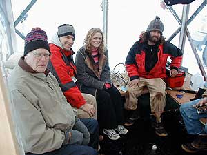 
Artist Jonas Lindberg entertains family in his tiny but comfortable new home on Medicine Lake.  (MPR Photo/Marianne Combs)