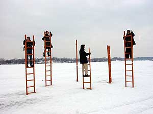 
Photographer Xavier Tavera explores negative space with his sculptural interpretation of an ice shack. Visitors to the Art Shanty Project feel compelled to climb the ladders embedded in ice and check out the view. (MPR Photo/Marianne Combs)