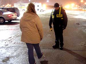 
Drivers police suspect are intoxicated are run through
a number of field sobriety tests, including walking a straight line and reciting the alphabet. Fargo police say raising public awareness is one goal of the checkpoints. (MPR photo/Dan Gunderson)