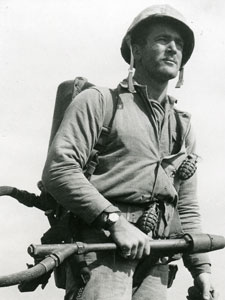 
Cpl. Charles W. Lindberg, who won the Silver Star for bravery at Suribachi's base, looking for entrances along crater's rim after the first flag was raised. (Photo: Lou Lowery, from the collection of Charles Lindberg)