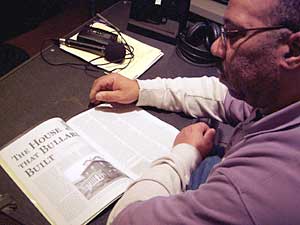 
Jerry Blakey reads about his grandfather, Casiville Bullard's life, in an article in Minnesota History magazine.    (MPR Photo/Toni Randolph)