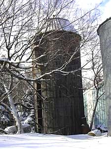 
This old silo and a granary building are all that's left of the farm where Berndt grew up. It's across the road from the landfill. Her parents built a new house next to the old farm in 1974. (MPR Photo/Melanie Sommer)
