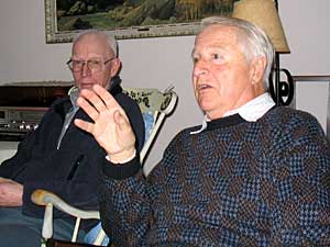 
Hale, right, with Winston Riedesel in Riedesel's home near the 3M plant. Depending on the direction the wind blows, Riedesel and his family can smell the plant. Riedesel complains that 3M hasn't been open enough about what it's producing and burning in its incinerator. (MPR Photo/Mike Edgerly)