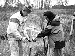 
Oliaei and her colleague, Joe Julik, are extracting soil samples to a depth of 25 feet, to determine the extent of the chemicals' spread. (MPR Photo/Sasha Aslanian)