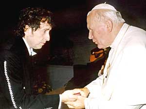 
Pope John Paul II greeting American balladeer Bob Dylan after he performed in a concert during a Catholic Youth rally in the city of Bologna in September 1997, attended by the pontiff. 
 (Photo by VATICAN POOL/AFP/Getty Images)