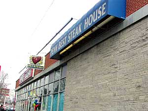 
This restaurant on Penn Ave. in Minneapolis was the scene of the city's most recent homicide, where two men were shot to death. Police are still looking for suspects.  (MPR Photo/Art Hughes)