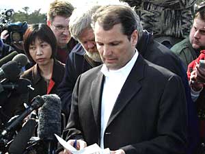 
FBI Agent Paul McCabe reads the names of those killed in the Red Lake shooting during a news conference Tuesday in Red Lake.  (Photo by JEFF HAYNES/AFP/Getty Images)