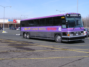 
Shuttle buses, like this one from Mystic Lake bring lots of people to tribal casinos to take their chances on slot machines. (MPR Photo/ Mark Zdechlik)