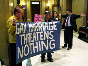 
Opponents of the bill calling for a vote  on a constitutional amendment defining marriage demonstrated outside House chambers. (MPR Photo/Michael Khoo)
