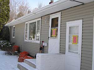 
This house was sealed up after police officers found a meth lab inside.  Cops say it's getting harder to find meth labs because they're being simplified and made portable.  (MPR Photo/Tim Post)