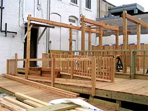 
CC's Club in Minneapolis is building an outdoor deck to accomodate smokers who can no longer light up inside. (MPR Photo/Jim Bickal)