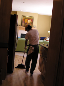 
Flores sweeping the floors.  (MPR photo/Bianca Vazquez Toness)
