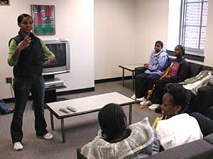 
Suzie Gebre Hewitt is Vice President of the Black Student Union at the U's Twin Cities campus.  She's talking to a large group of African American middle and high school students, trying to interest in the University of Minnesota.
 (MPR News/Marisa Helms)