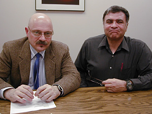 
Rich Caligiuri, left, is the director of Minnesota's dislocated worker program and oversees administration of federal Trade Adjustment Assistance grants in the state.  At right is Fil Chairez, a member of Minnesota's dislocated worker Rapid Response Team. (MPR Photo/Jeff Horwich)