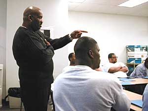
Project Soar's Marvin Clark leads inmates in a 13-week class preparing them for their release.  (MPR photo/Dan Olson)