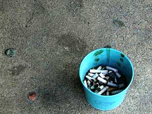 
A can of cigarette butts sits outside the door of the "Otter Bar". (MPR Photo/Art Hughes)