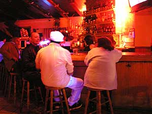 
The Minneapolis Latino bar Margarita Bella, offers La Coco on stage and some informal HIV education.  At the back of the room there's a table covered in condoms. La Coco's message is clear.  Use a condom and get tested. She says AIDS is now something you can live with for years if you get proper treatment. La Coco even lines up free testing at the bar. 
 (MPR Photo/Bianca Vazquez Toness)