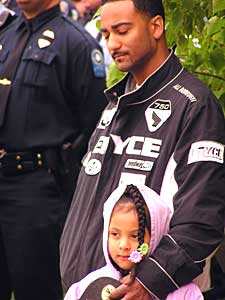 
Many area residents stood along the funeral procession to pay their respects to Vick.  (MPR Photo/Bianca Vazquez Toness)