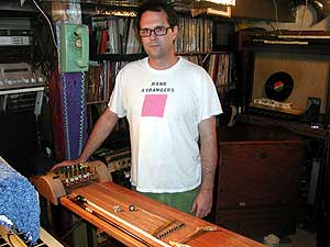 
Dave Krejci stands over his invention. It seems inevitable that Krejci would develop something like the Cleophone. All his life he's tinkered with objects that emit sounds. (MPR photo/Chris Roberts)