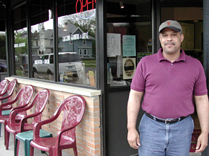
Michael Wright says business is good, but it hasn't been easy selling gourmet coffee in a  neighborhood that, he says, is still in transition.
 (MPR Photo/Marisa Helms)