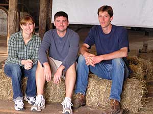 
Three friends helped start a film festival a barn in Wrenshall, Minnesota. Valerie Coit, Mike Scholtz, and Janaki Fisher-Merritt sit in the main level screening room of the big red barn where they hold a film festival in July. (MPR Photo/Stephanie Hemphill)