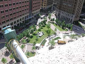 
The brass strings run across downtown St. Paul to a resonator on the Landmark Plaza. The resonator stands on the square stage in the center of the picture. (MPR photo/Chris Roberts)
