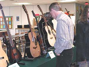 
Guitars made by the class are on display at the college graduation (MPR Photo/Erin Galbally)