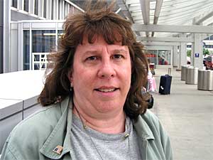 
Northwest customer Paula Christiansen says she would book away from the airline if mechanics union work slowdowns cause flight delays and cancellations. (MPR Photo/Mark Zdechlik)