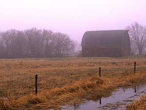 
This barn, shrouded in fog, was built in the 1920s in Kanabec County. (Photo by Doug Ohman from the book "Barns of Minnesota")