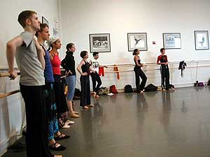 
Dancers listen as Toni Pierce-Sands shares her critique at one of the final rehearsals of TU Dance at the Barbara Barker Center for Dance.  (MPR Photo/Marianne Combs)