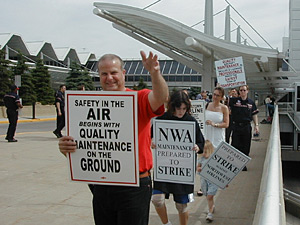 
Northwest mechanics picketed earlier this month outside Minneapolis St. Paul International Airport.  Mechanics have said they are unwilling to consider the kind of job cuts proposed by the airline in negotiations. (MPR Photo/Jeff Horwich)