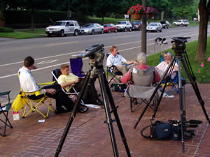 
 With negotiations going on behind closed doors at the Governor's Residence, reporters camped out waiting for word of progress. (MPR Photo/Michael Khoo)