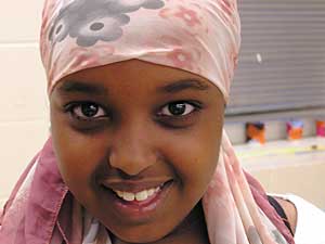 
Hodo Ibrahim, 10, and her sister, Ayan, belong to Farheen Hakeem's all-Muslim Girl Scout troop which meets at Bryan Coyle Community Center in Minneapolis. (MPR Photo/Bianca Vazquez Toness)
