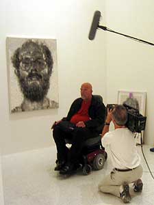 
Close supervises installation of the Walker show. He is being followed by a BBC documentary unit. (MPR Photo/Euan Kerr)