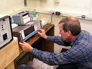 
MPCA Air Quality Scientist Jeff Cooley regularly checks air monitoring equipment for accuracy.  (MPR Photo/Dan Gunderson)