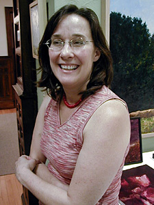 
Sally Johnson runs Groveland Gallery where Matthew Smith used to show his work. She still has a few of his paintings left and hopes someday he'll pick up his paintbrush again. (MPR Photo/Marianne Combs)