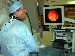 
Dr. Portis can follow his progress on the screen above. (MPR Photo/Lorna Benson)