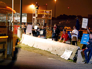
Striking Northwest Airlines Mechanics Union members shout comments at a bus carrying replacement workers outside the Minneapolis-St. Paul International Airport early on Friday. (Photo by Cory Ryan/Getty Images)