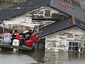 
Ronald Wood is rescued from his home in New Orleans, Louisiana after Hurricane Katrina made landfall. (JAMES NIELSEN/AFP/Getty Images)